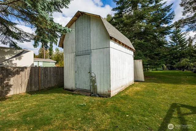 a wooden bench sitting in middle of a field