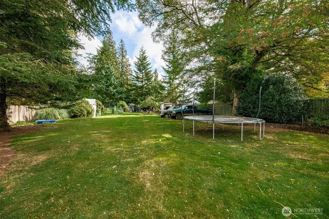 a backyard of a house with lots of green space