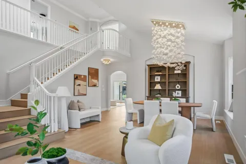 a living room with furniture and a potted plant