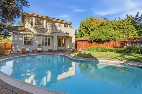 a view of a house with a swimming pool