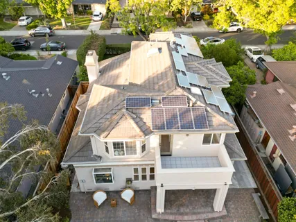 an aerial view of residential houses with outdoor space