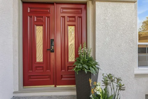 view of front door with red door