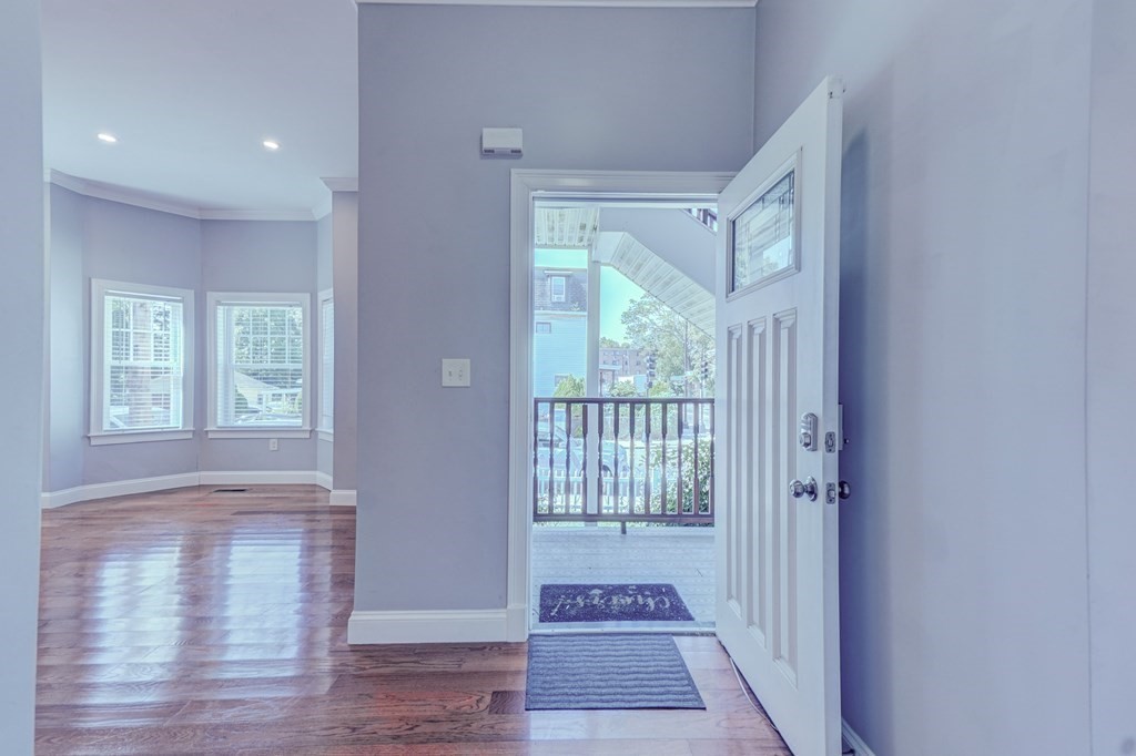 1008-1010 River Street, Unit 1 Boston, MA 02136 - Photo 14 of 29 a view of hallway with windows