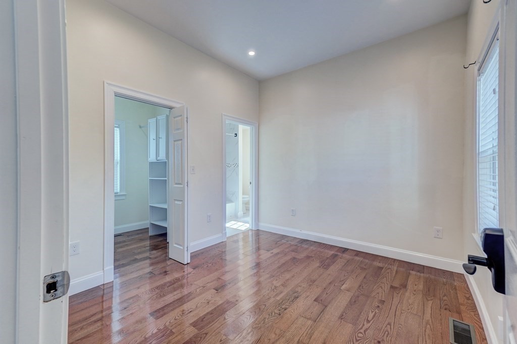 1008-1010 River Street, Unit 1 Boston, MA 02136 - Photo 18 of 29 wooden floor in an empty room