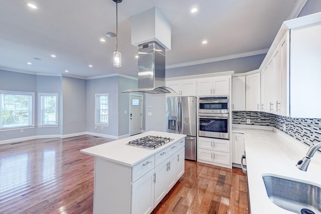 1008-1010 River Street, Unit 1 Boston, MA 02136 - Photo 2 of 29 a kitchen with a sink stove and refrigerator