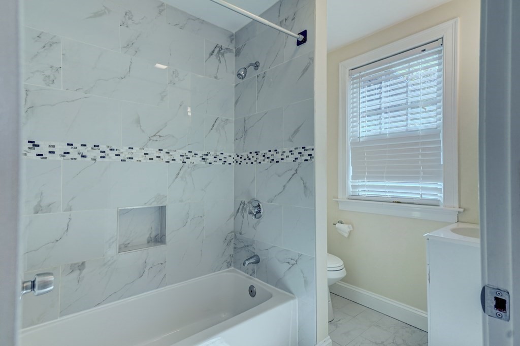 1008-1010 River Street, Unit 1 Boston, MA 02136 - Photo 22 of 29 a bathroom with a shower