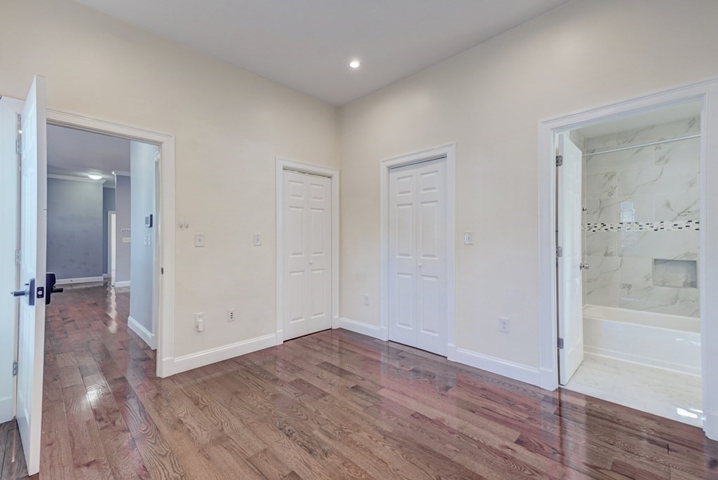 1008-1010 River Street, Unit 1 Boston, MA 02136 - Photo 25 of 29 wooden floor in an empty room