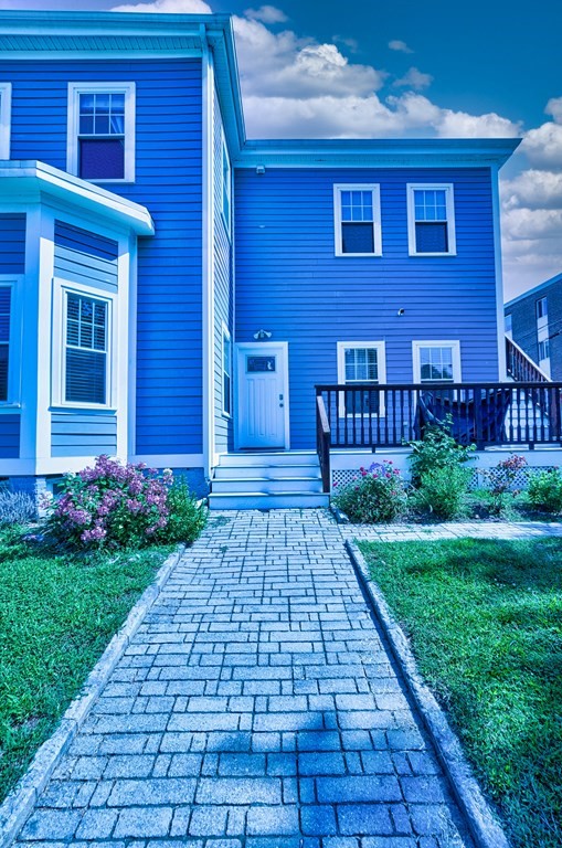 1008-1010 River Street, Unit 1 Boston, MA 02136 - Photo 29 of 29 a view of a brick house with a yard
