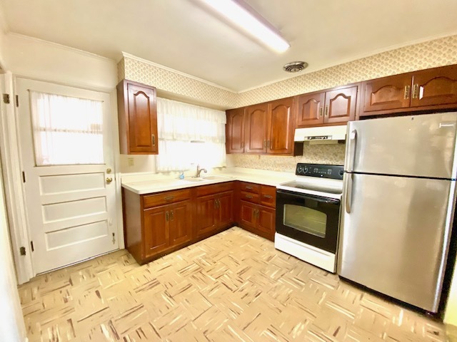 1026 Midway Road Northbrook, IL 60062 - Photo 7 of 17 a kitchen with a refrigerator sink and cabinets