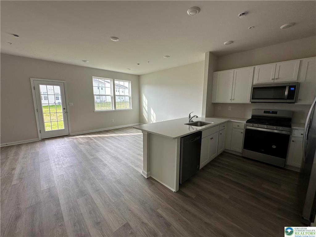 1145 Martin Road Breinigsville, PA 18031 - Photo 30 of 38 A well-appointed kitchen seamlessly integrates with a sun-drenched living space.