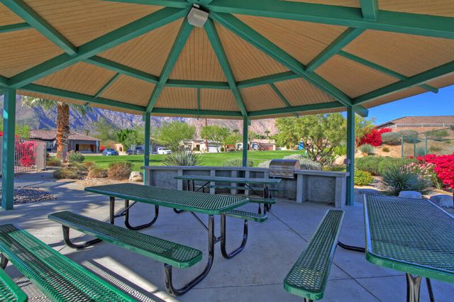 a view of a chairs and table in the patio