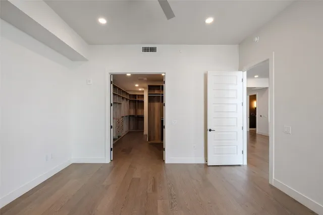 a bathroom with a bathtub and a double vanity sink