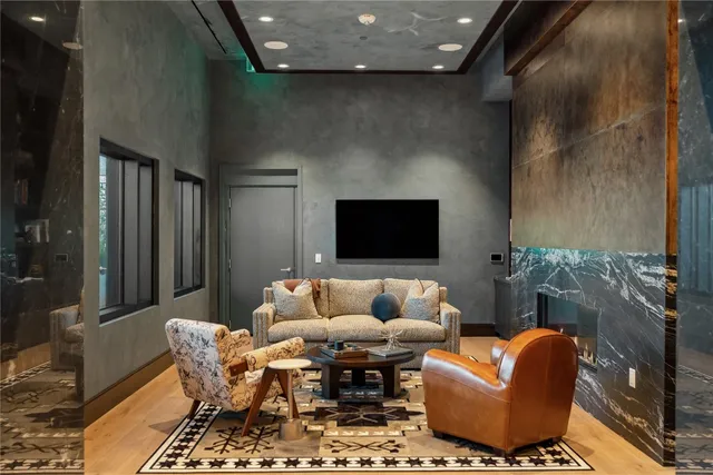 a view of a livingroom with furniture and windows