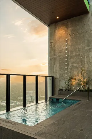 a outdoor living space with furniture and a flat screen tv