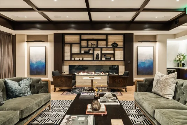 a dining room with furniture and chandelier