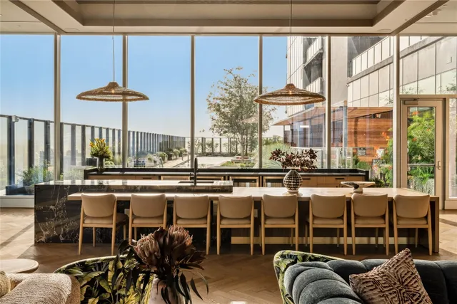 a dining room with furniture and wooden floor