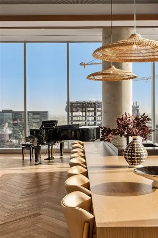 a living room with furniture a rug and a fireplace