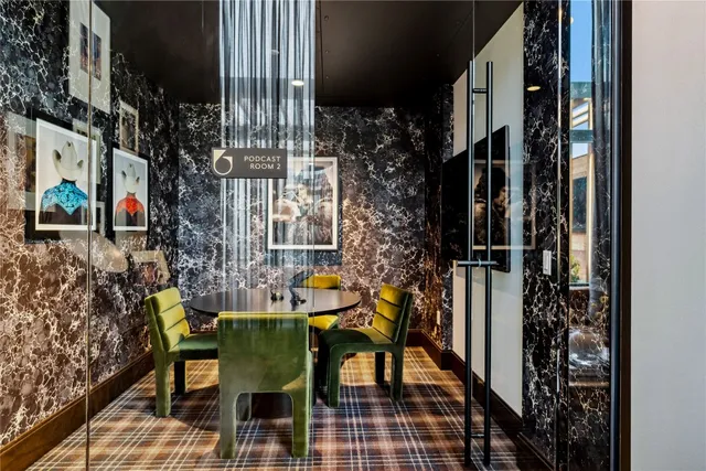 a living room with furniture pool table and flat screen tv