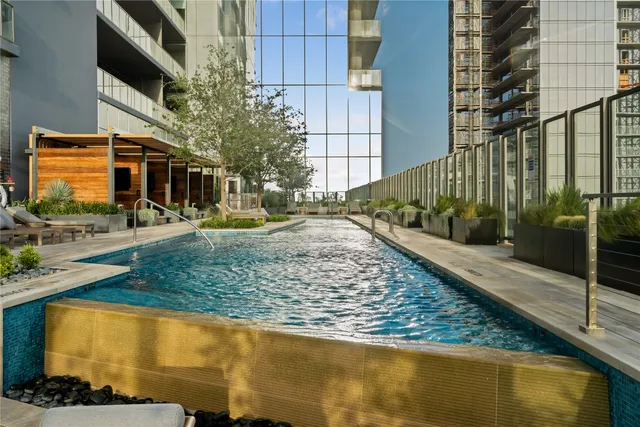 a living room with patio furniture and a fireplace