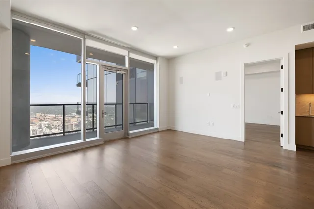 a kitchen with kitchen island white cabinets and stainless steel appliances