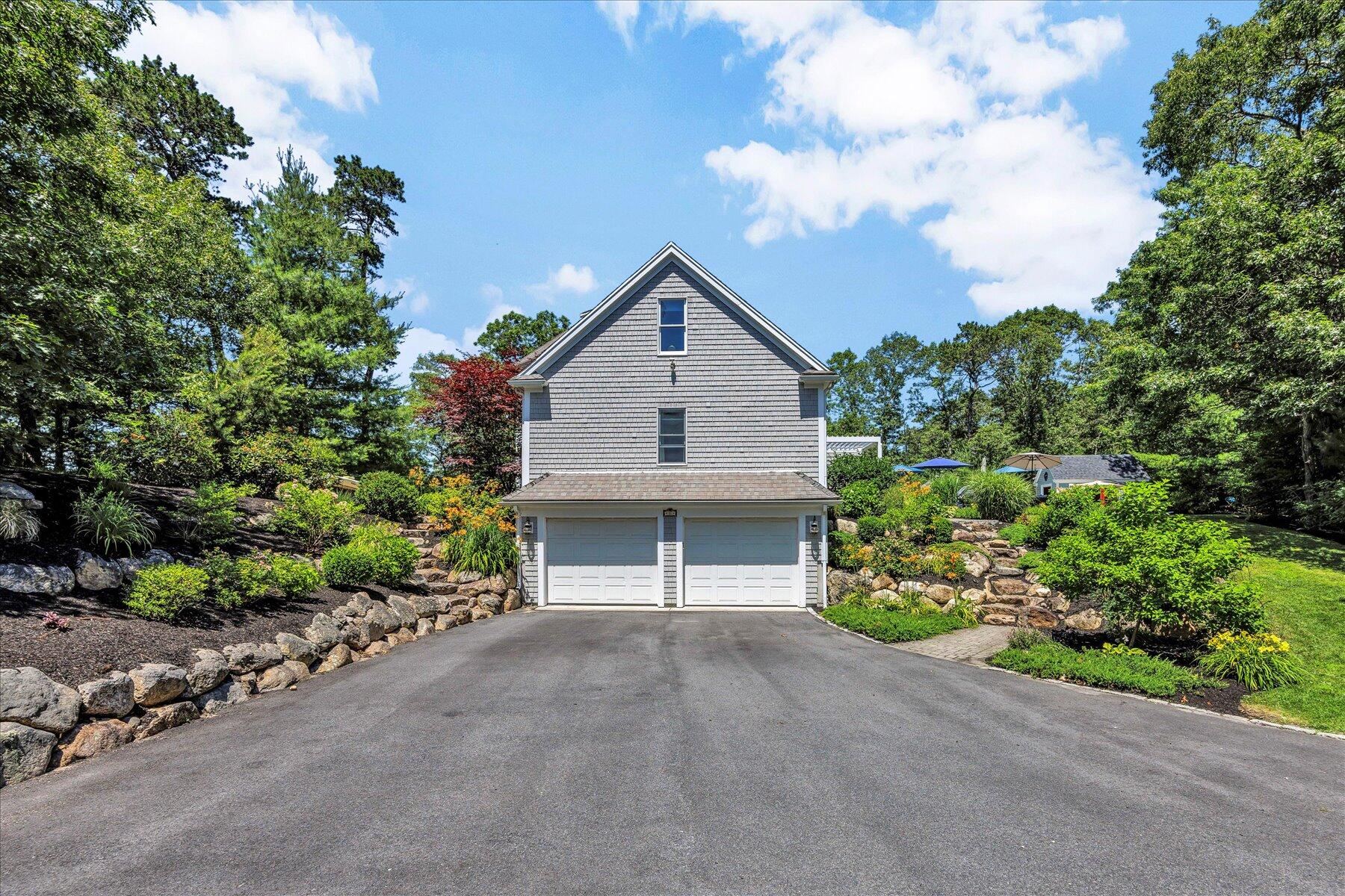 1 Ravens Nest Road Sandwich, MA 02563 - Photo 40 of 46 a front view of a house with a garden
