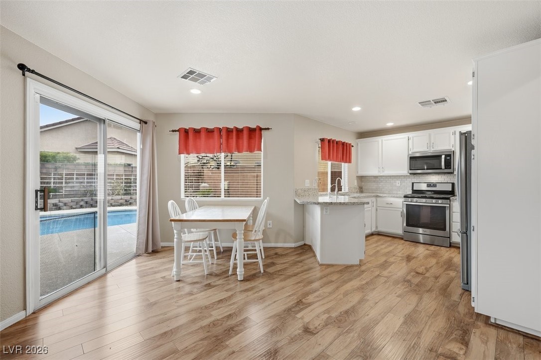 8125 West Back Packer Court Las Vegas, NV 89131 - Photo 11 of 31 Eat kitchen area with backyard views!
