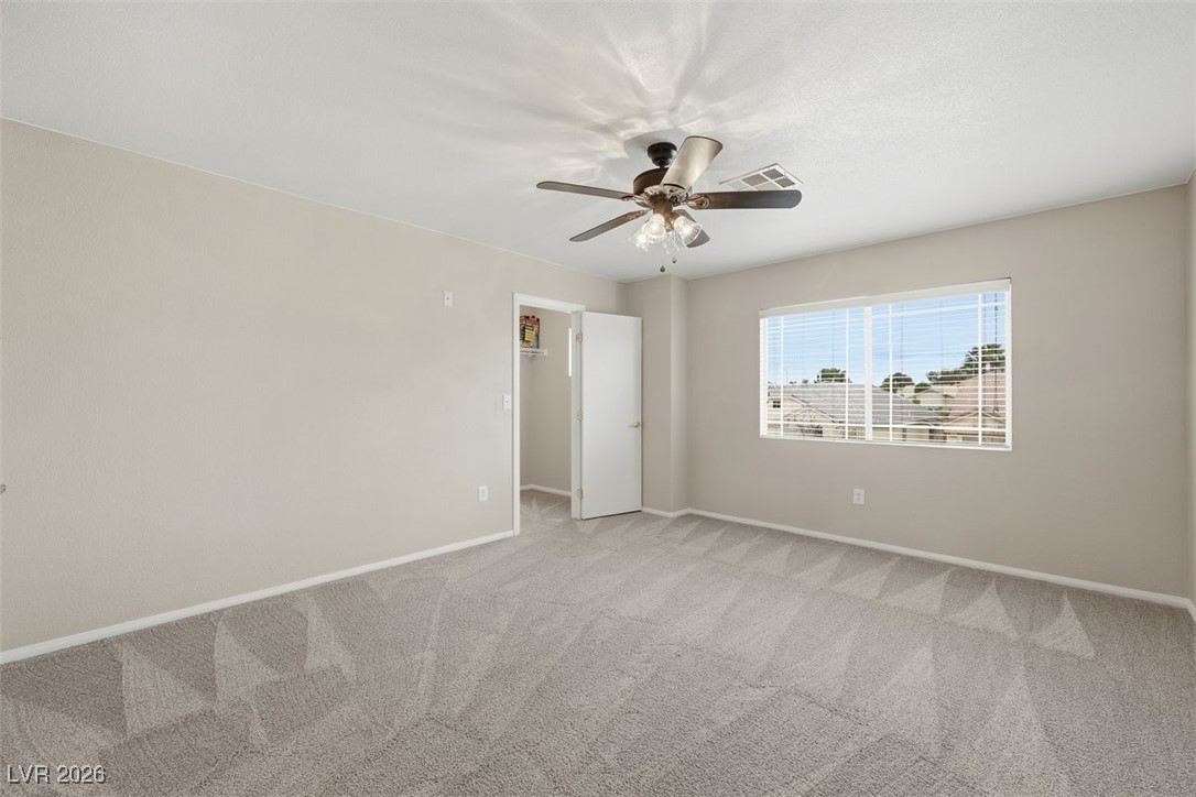 8125 West Back Packer Court Las Vegas, NV 89131 - Photo 22 of 31 Bedroom with walk in closet and c-fan