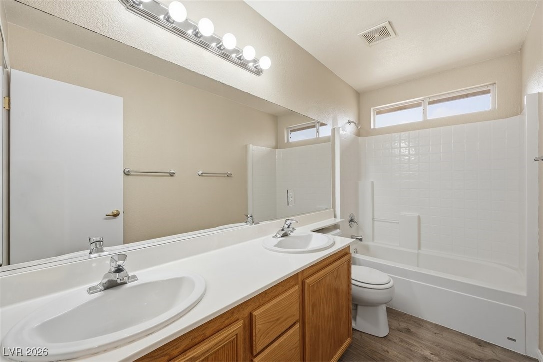 8125 West Back Packer Court Las Vegas, NV 89131 - Photo 24 of 31 Bathroom up with dual vanities, Luxury vinyl floors and a tub/shower!