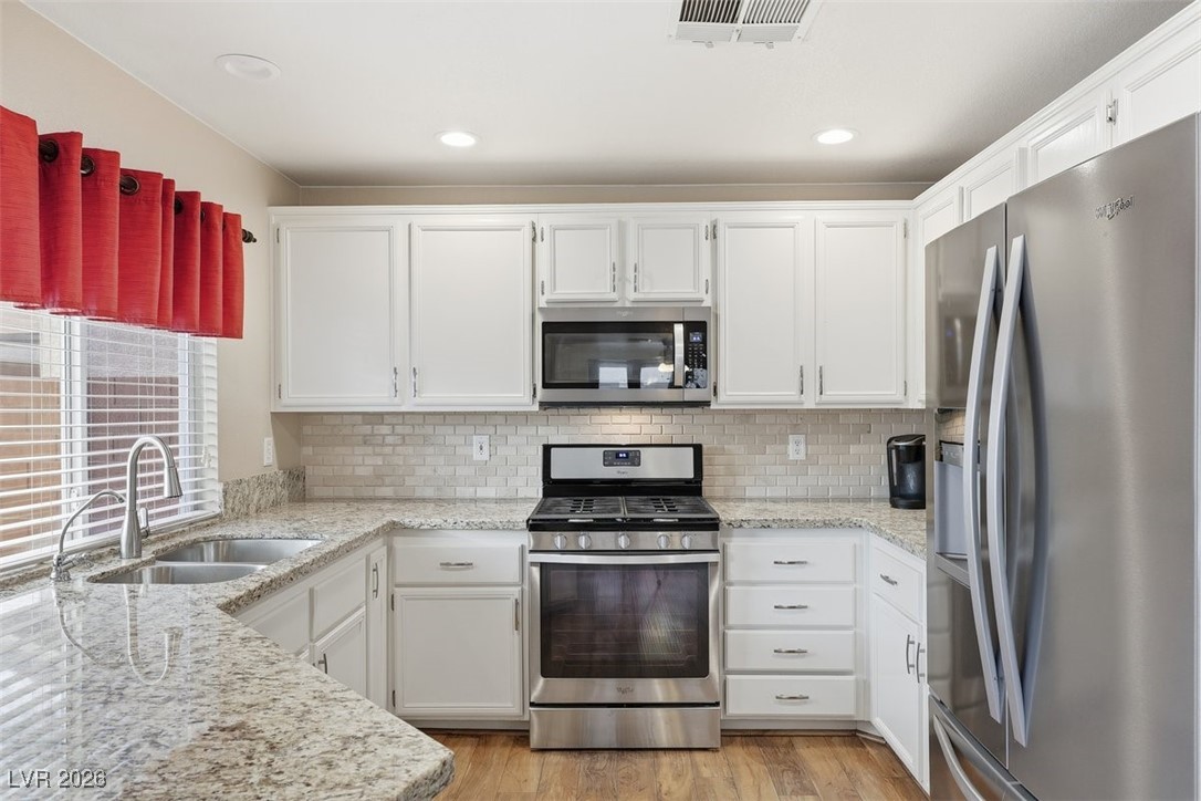8125 West Back Packer Court Las Vegas, NV 89131 - Photo 9 of 31 Stainless steel appliances & Tiled backsplash!