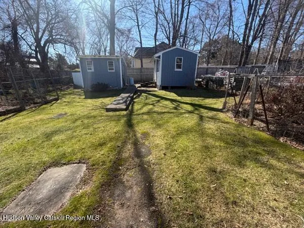 a view of a house with a yard covered with snow in the yard