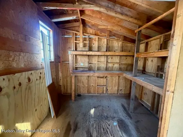 a view of washer and dryer with wooden floors
