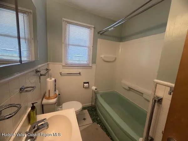 a bathroom with a sink and a bathtub