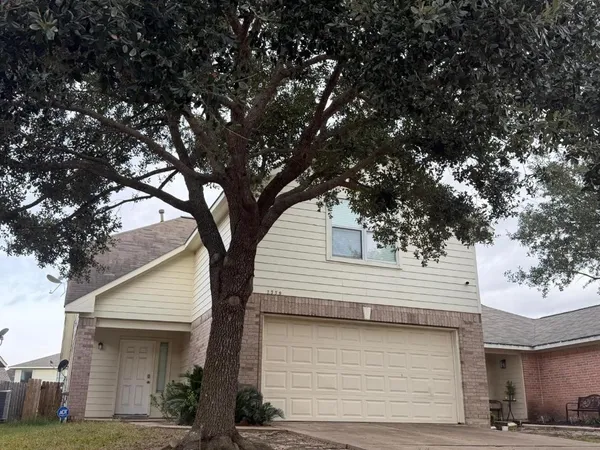 a front view of a house with garage