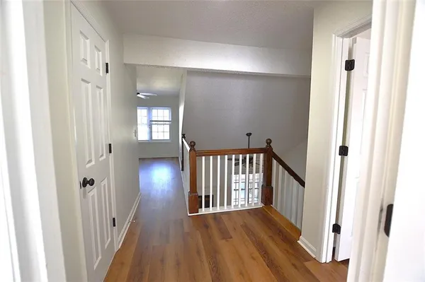 a view of gallery with wooden floor