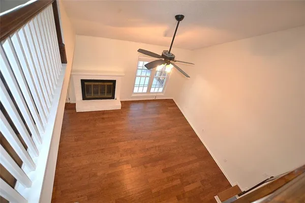 a view of an empty room with a fireplace
