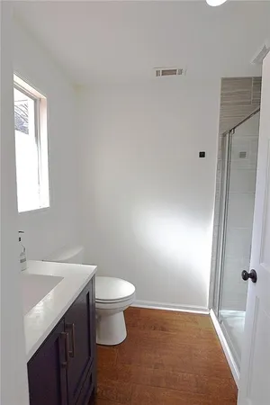 a bathroom with a sink toilet and vanity