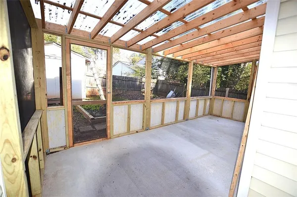 a view of empty room with floor to ceiling window