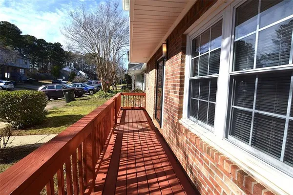 a balcony with view of outdoor space and sitting space