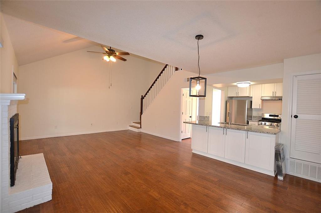 2085 Sand Wedge Circle Kennesaw, GA 30144 - Photo 6 of 35 a kitchen with kitchen island a counter top space appliances and cabinets