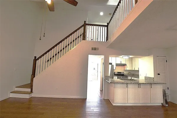 a view of kitchen with furniture and wooden floor