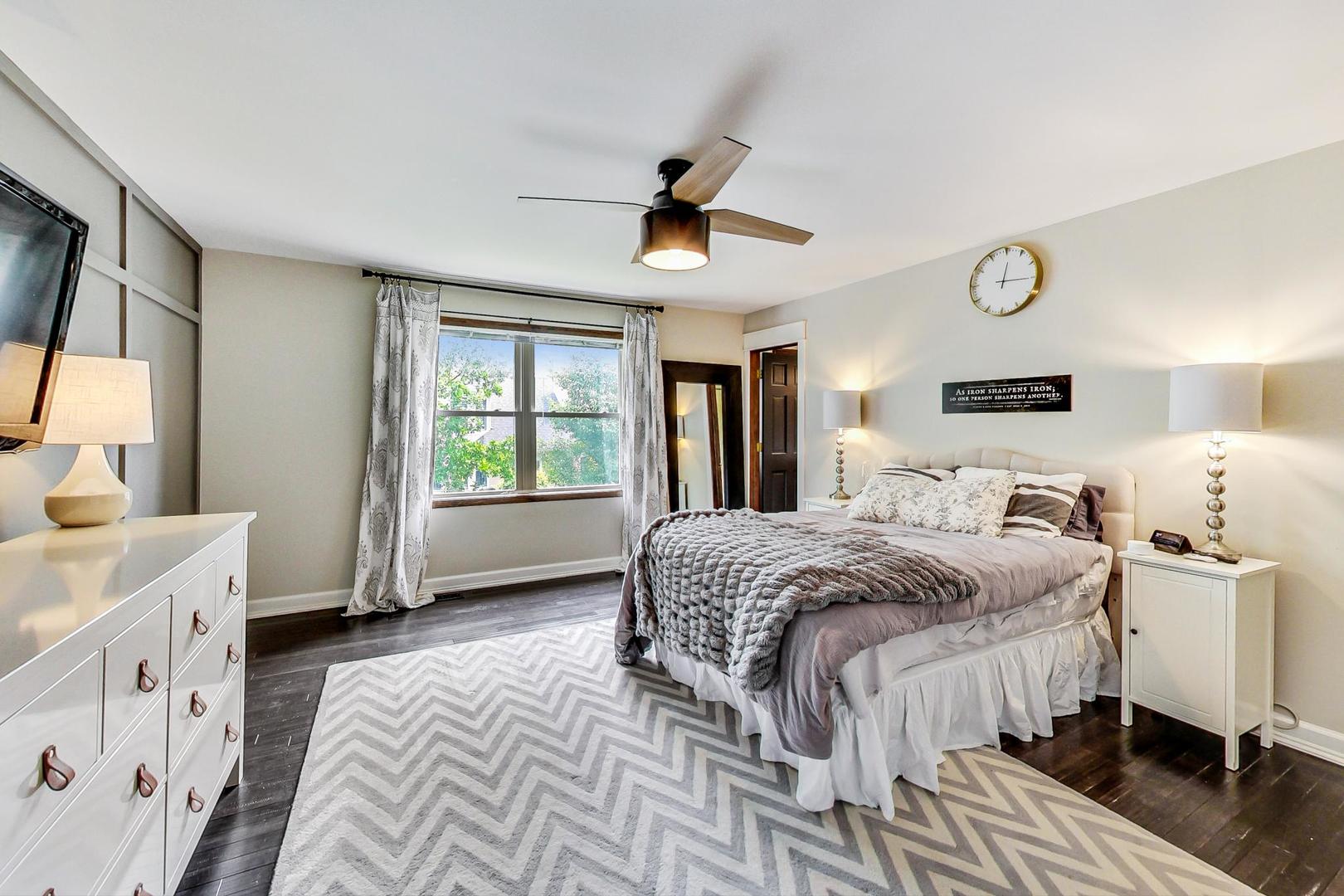 2230 Forest Ridge Road St. Charles, IL 60174 - Photo 20 of 37 a spacious bedroom with a large bed and a window
