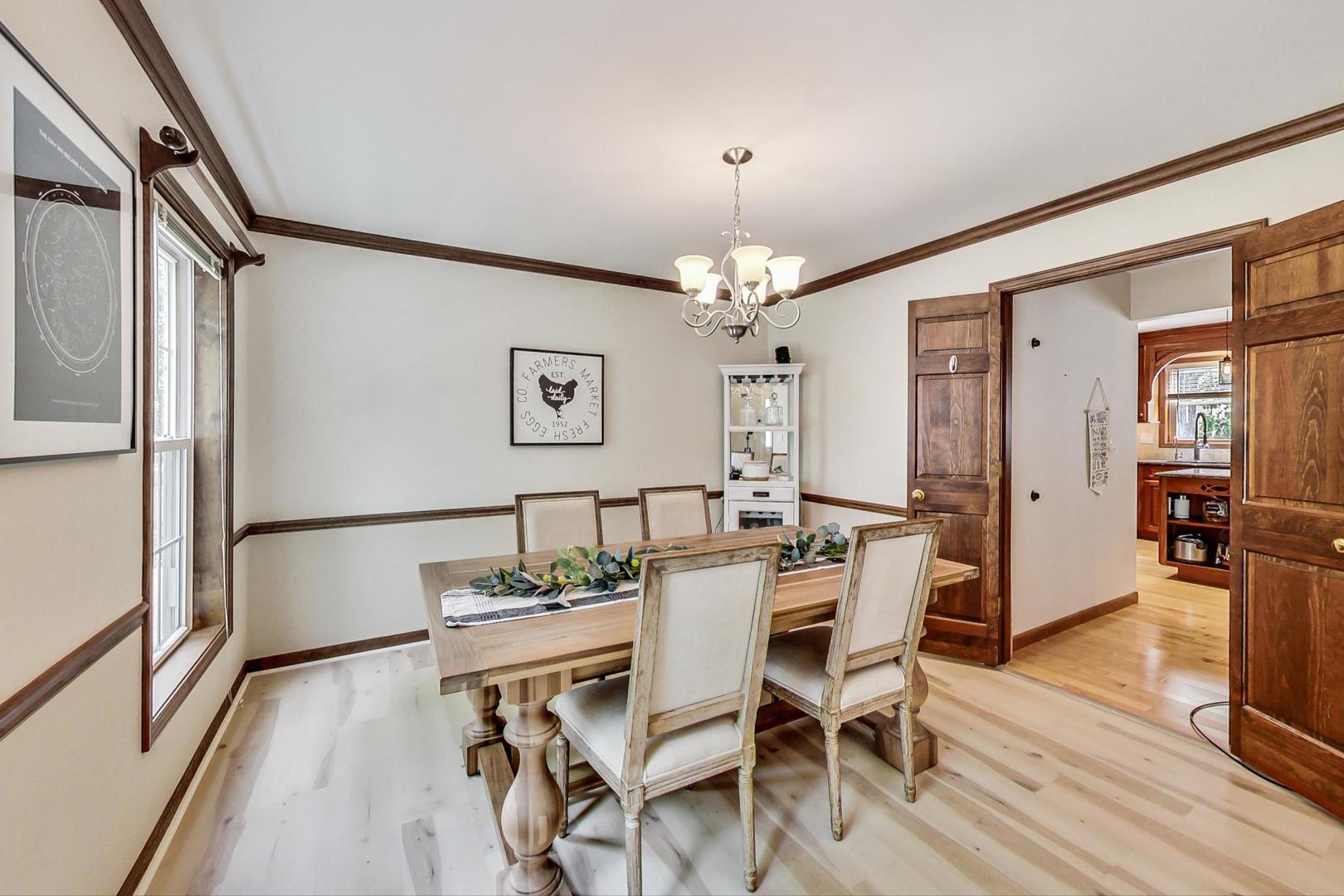 2230 Forest Ridge Road St. Charles, IL 60174 - Photo 8 of 37 a view of a dining room with furniture and wooden floor