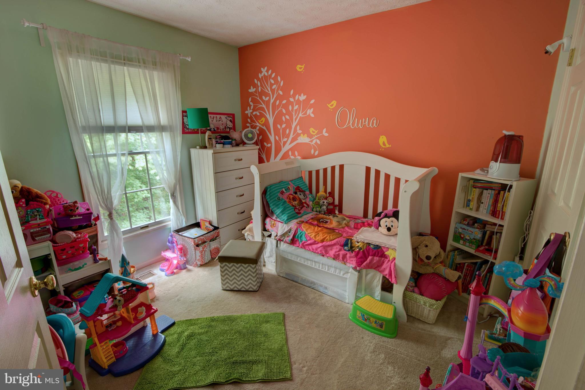 704 Streamside Drive Bowie, MD 20721 - Photo 16 of 24 a bedroom with furniture a rug toys and a window