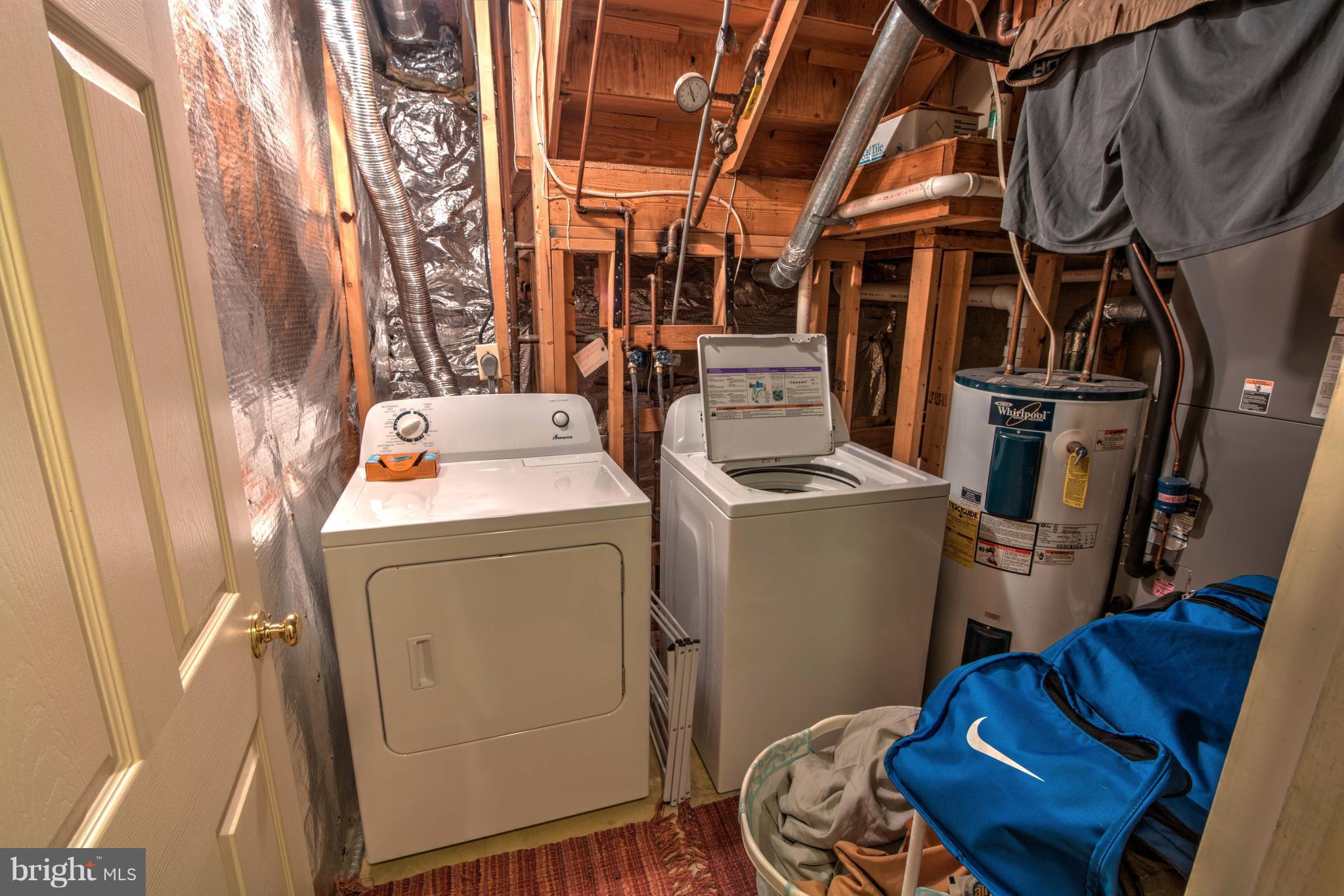 704 Streamside Drive Bowie, MD 20721 - Photo 18 of 24 a utility room with dryer and washer