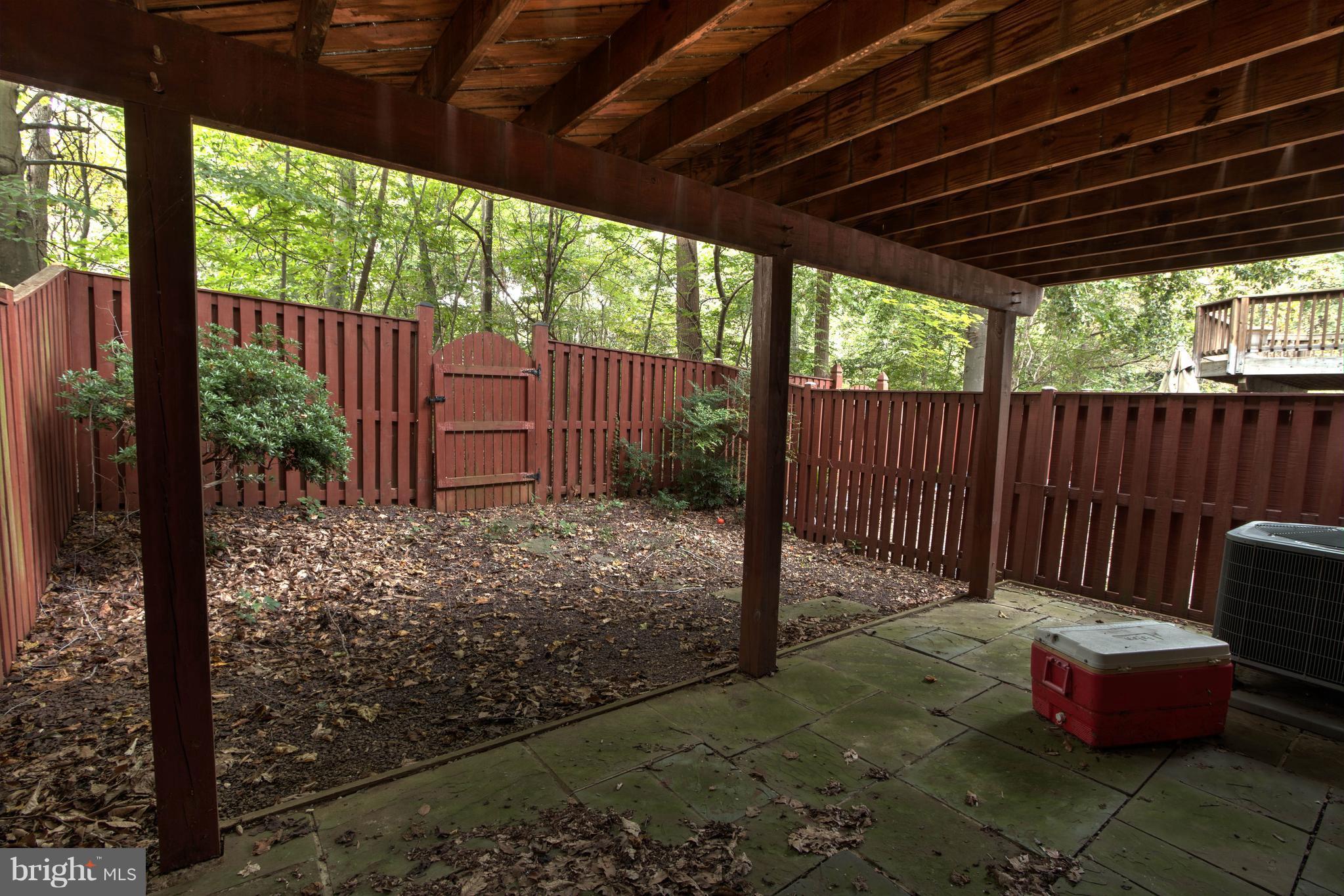 704 Streamside Drive Bowie, MD 20721 - Photo 23 of 24 a view of a backyard with furniture