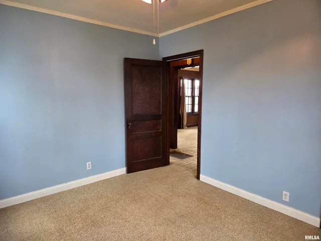 a bathroom with a toilet a sink a vanity and mirror
