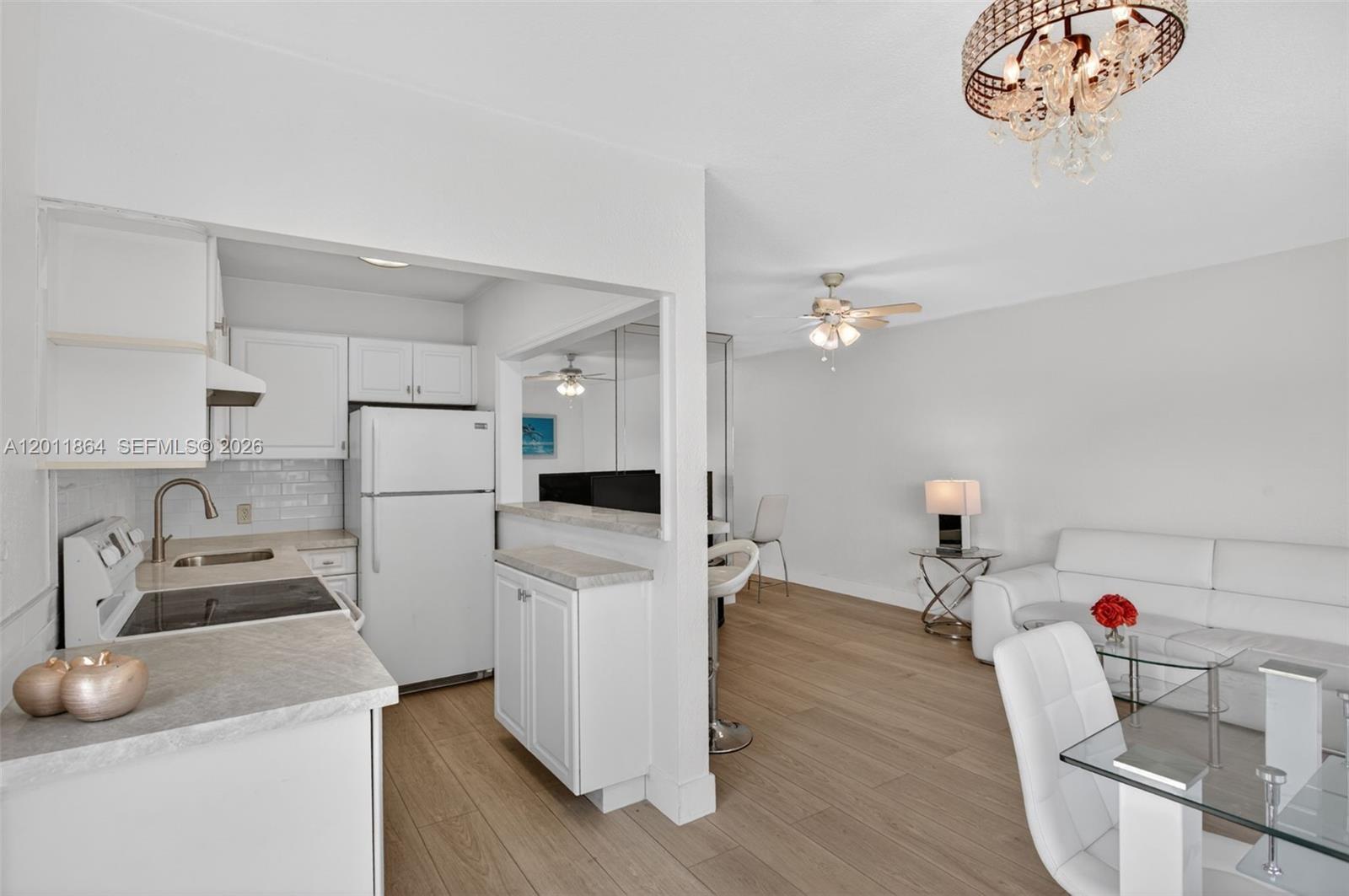 615 South Riverside Drive, Unit 5 Pompano Beach, FL 33062 - Photo 11 of 29 a kitchen with refrigerator and cabinets