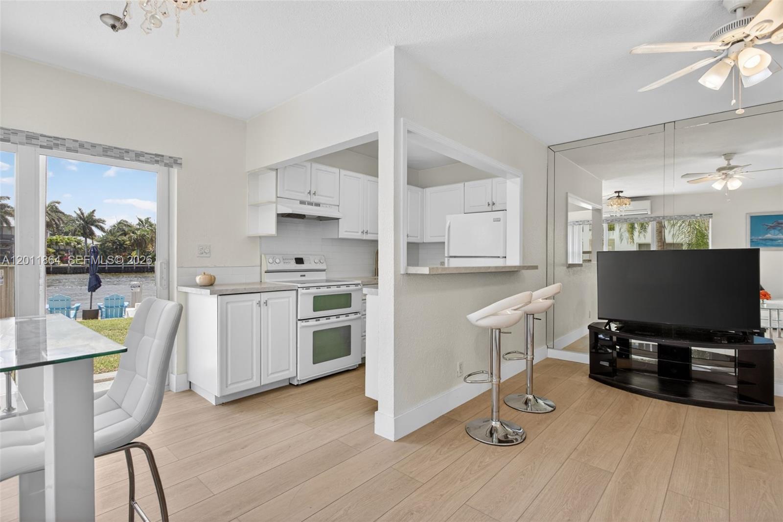 615 South Riverside Drive, Unit 5 Pompano Beach, FL 33062 - Photo 12 of 29 a view of kitchen with sink and wooden floor