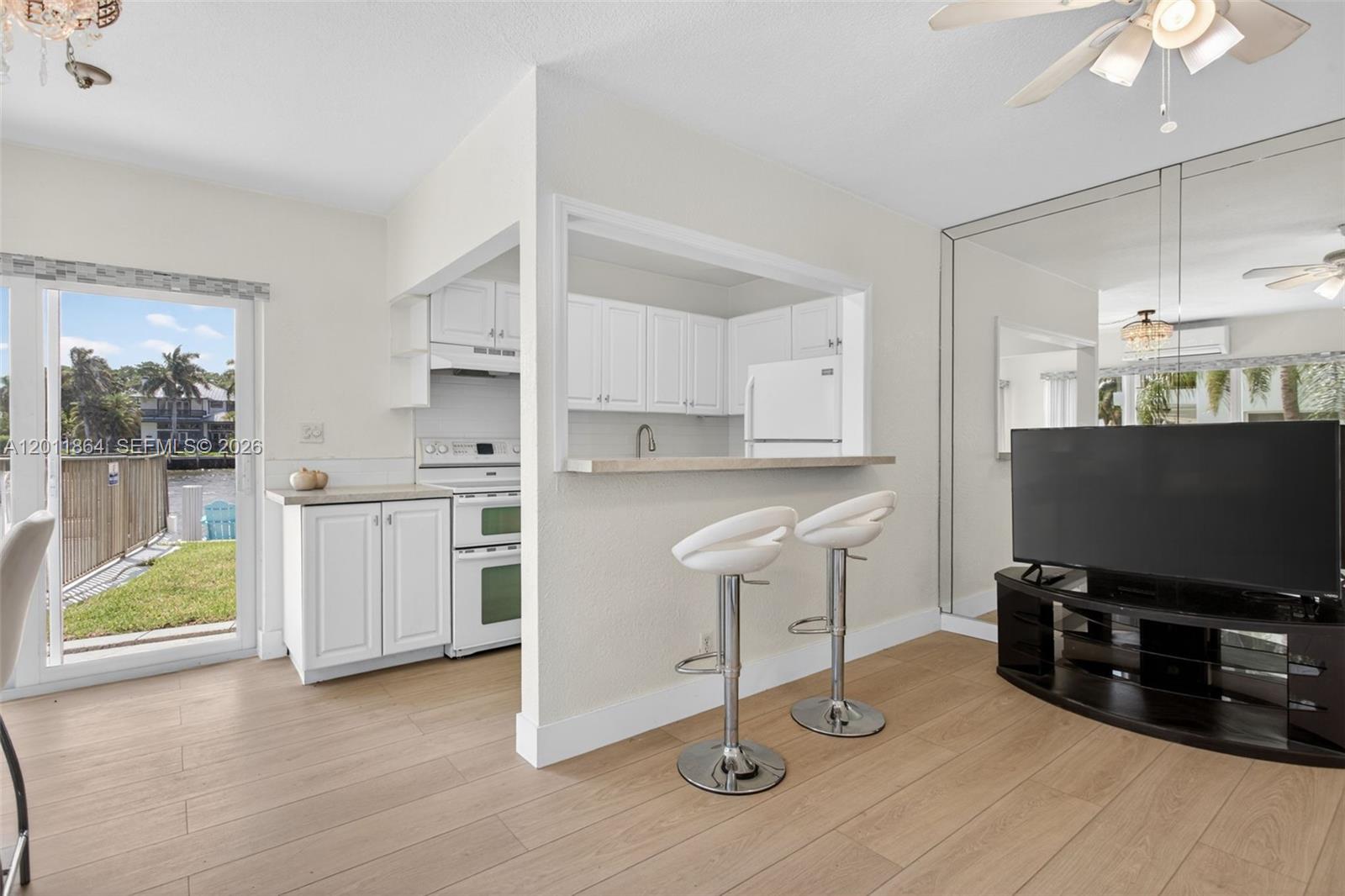 615 South Riverside Drive, Unit 5 Pompano Beach, FL 33062 - Photo 13 of 29 a kitchen with stainless steel appliances a stove a sink and a refrigerator