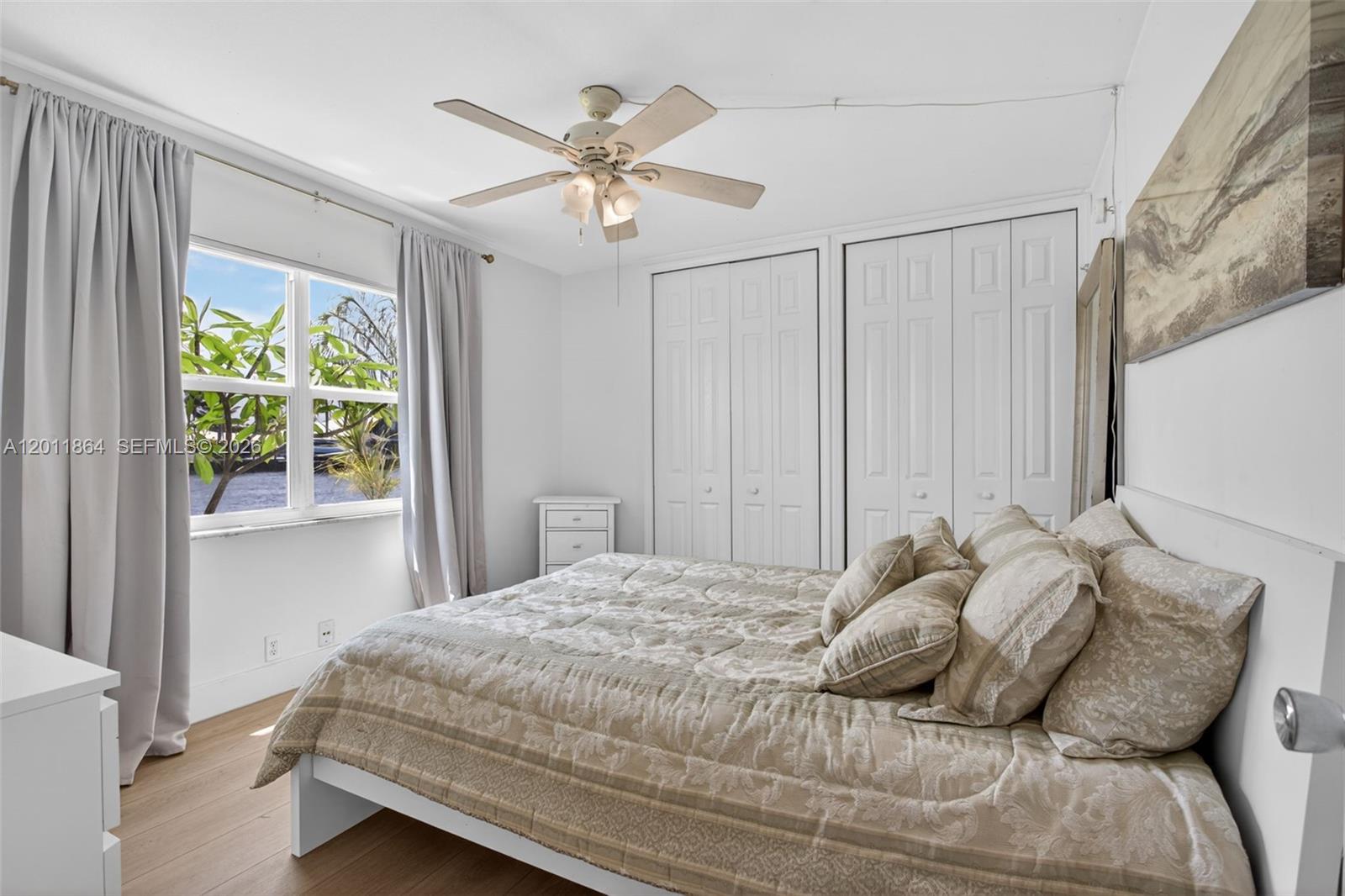 615 South Riverside Drive, Unit 5 Pompano Beach, FL 33062 - Photo 16 of 29 a bedroom with a bed and a window